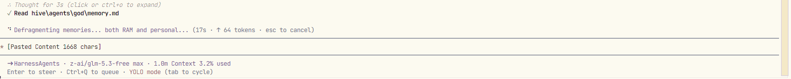 The footer of a Qwen session: a tool call reading hive/agents/god/memory.md, a memory-defragmenting status line, and a status bar showing the model in use with 3.2 percent of a one-million-token context consumed.